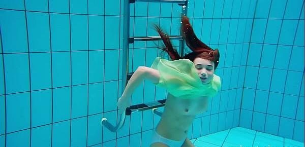  Hairy teen babe Nina Mohnatka swims in the pool